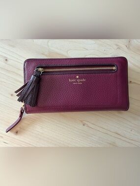 kate spade Burgundy Pebbled Leather Zip Wallet with Tassel